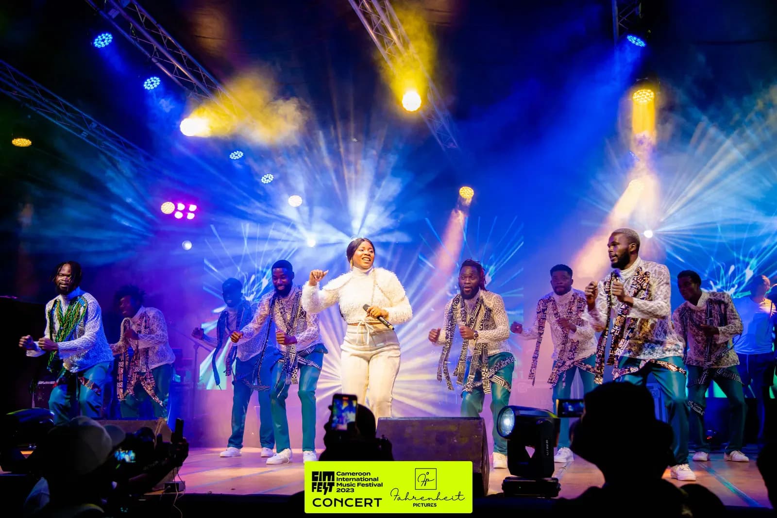 A full band performing under the CIMFEST stage lights
